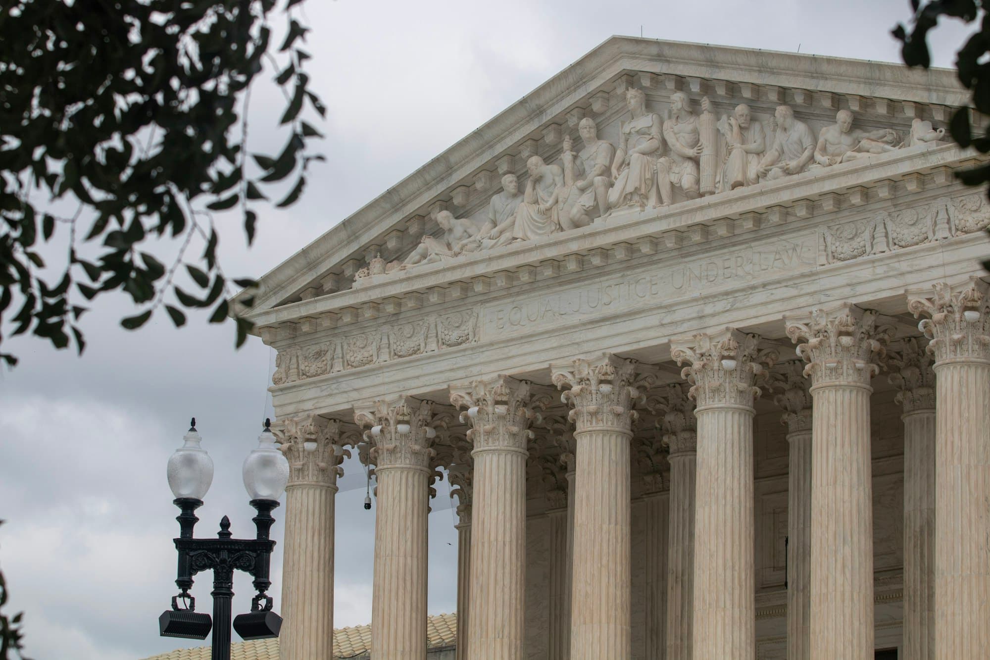 The Supreme Court building with marble columns and pediment sculptures