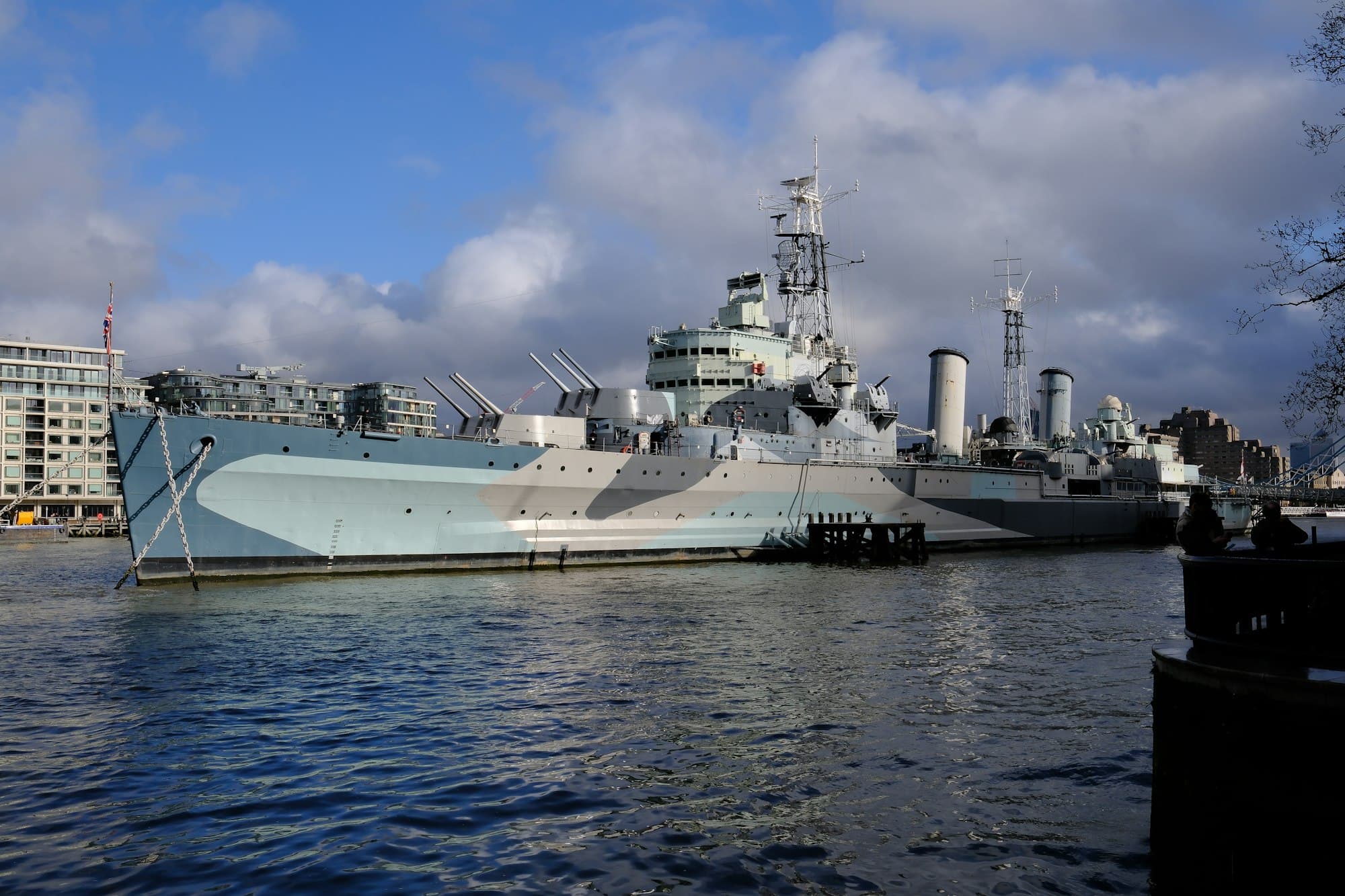 The camouflaged Second World War cruiser HMS Belfast moored on the River Thames