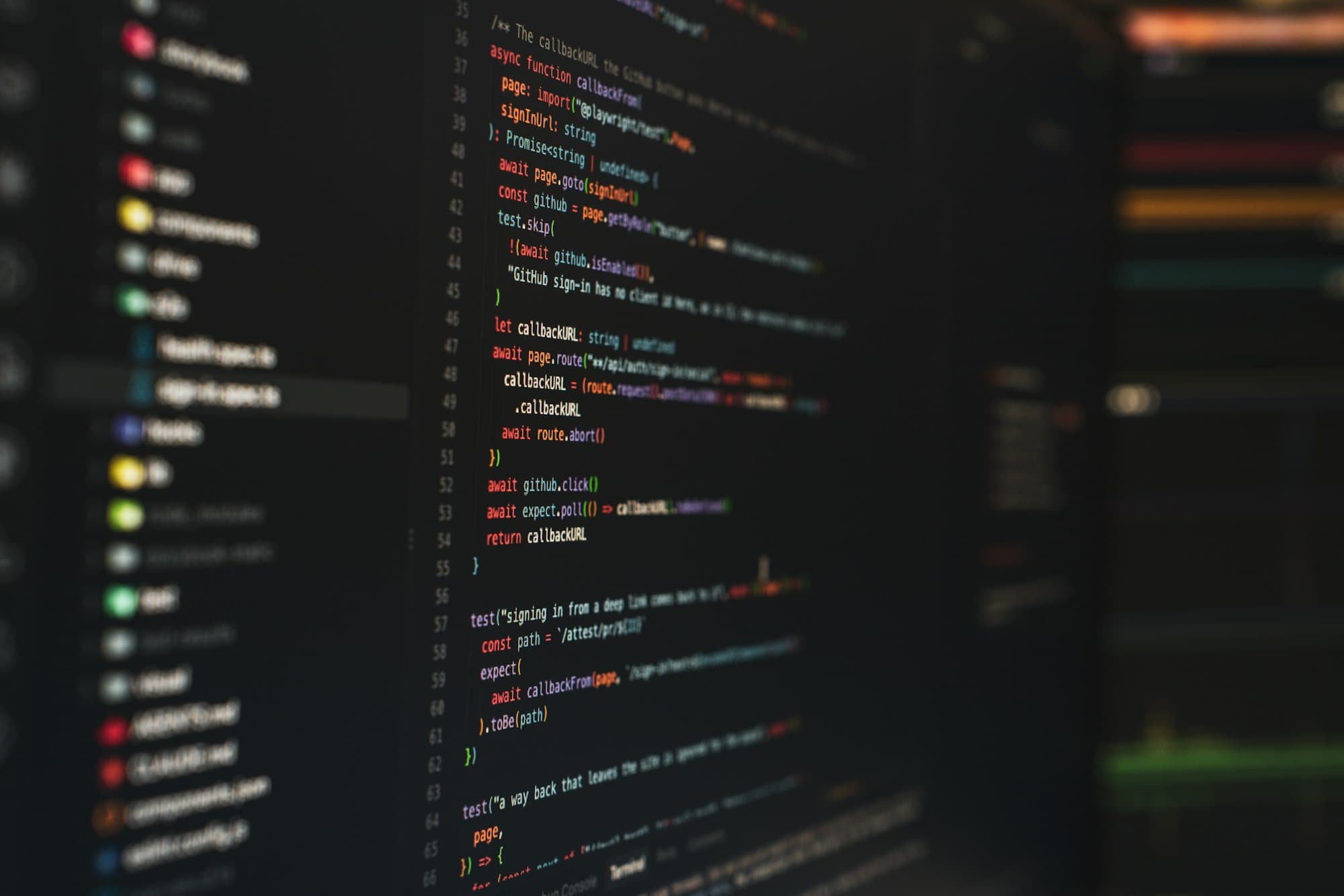 Colorful source code displayed on a dark computer monitor
